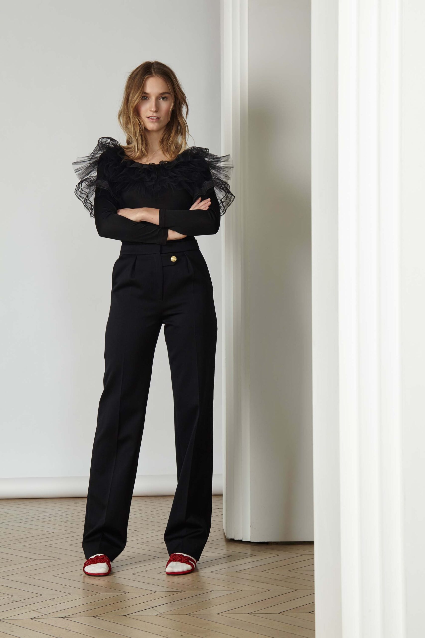 black fitted top and tailored pants