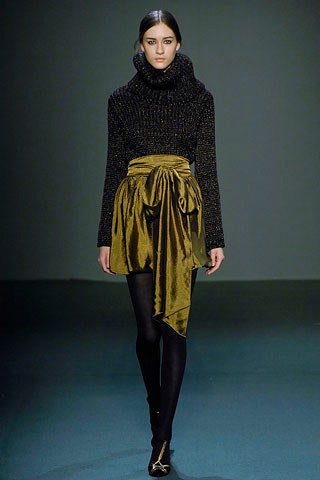 black wool turtleneck top and green velvet skirt