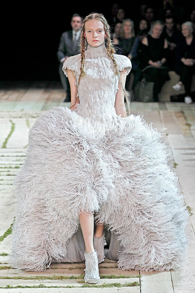white feathered sleeveless gown