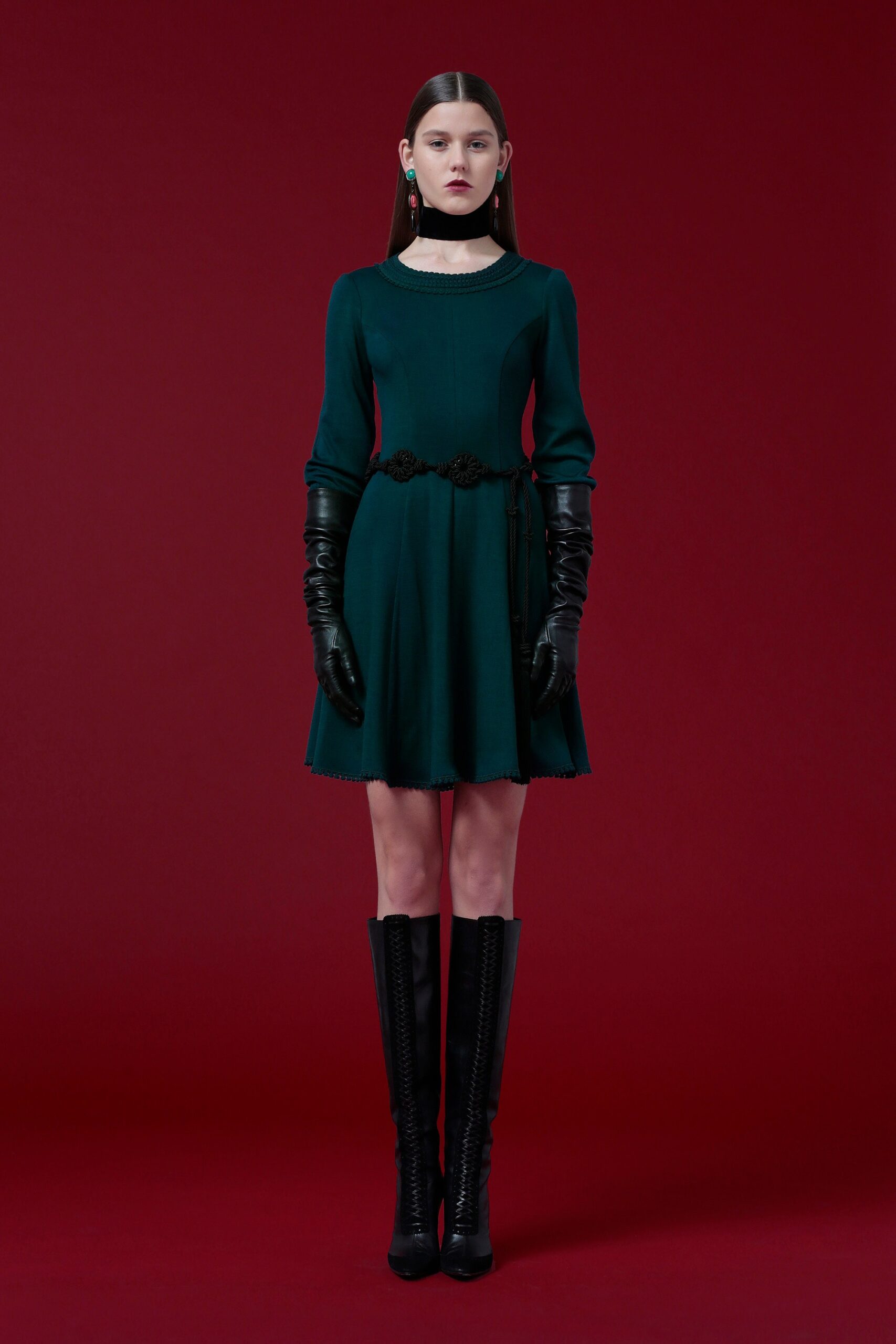 green fitted mini dress with gloves and boots