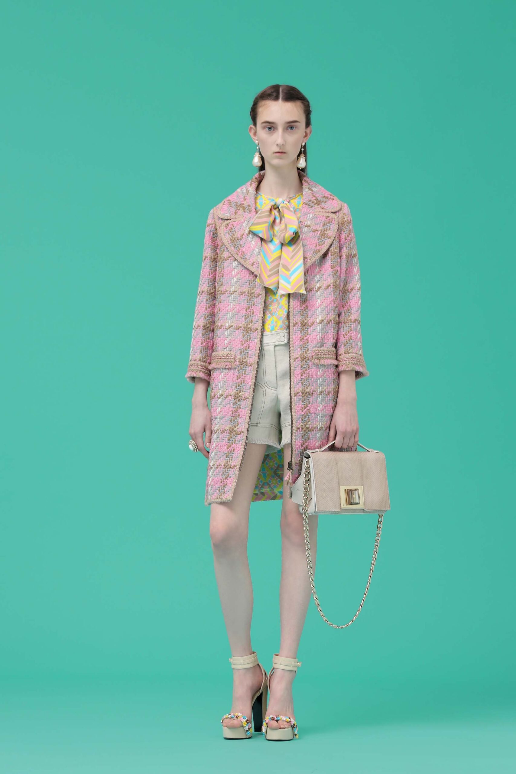 pink tweed coat with colorful top