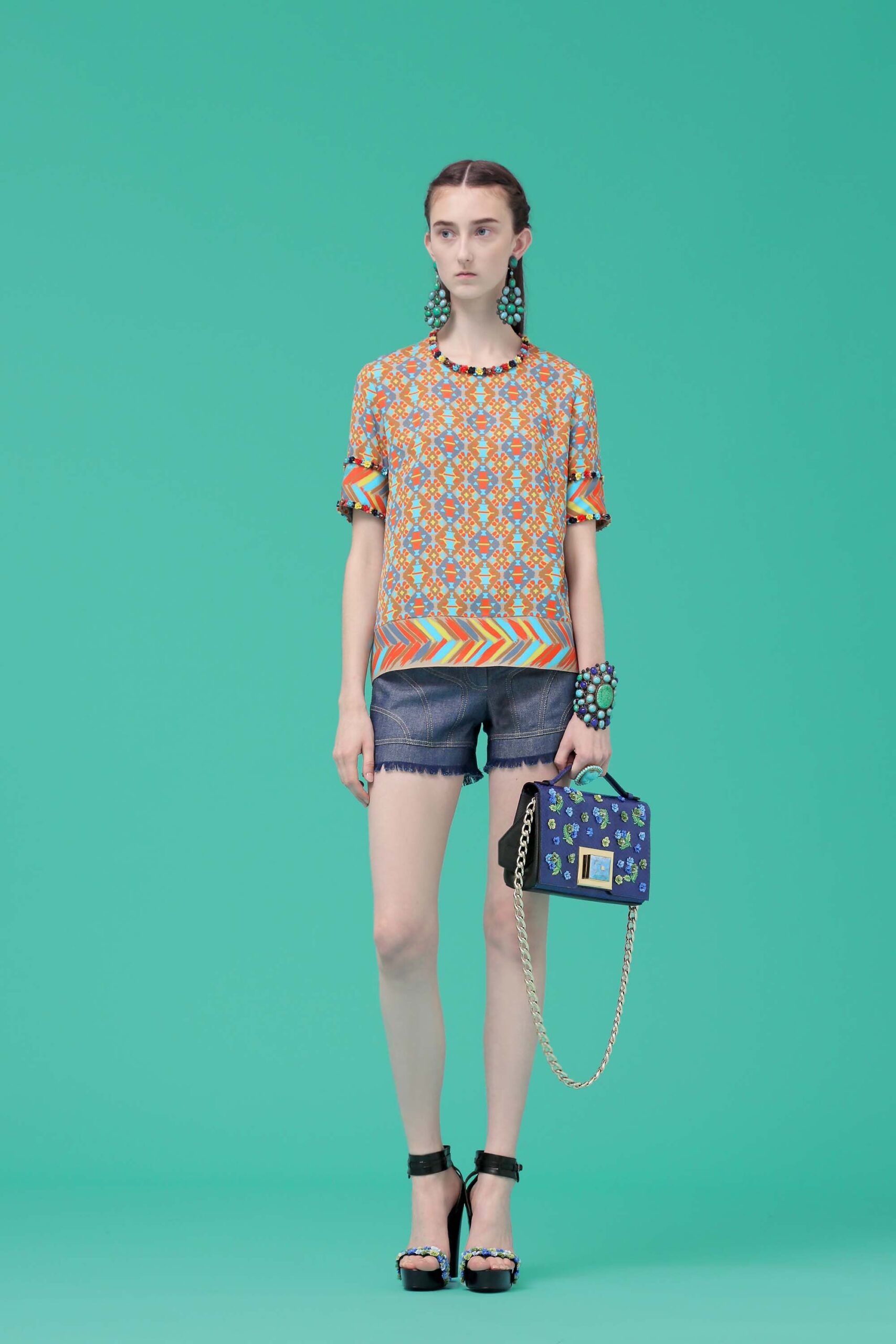 colorful printed top with denim shorts