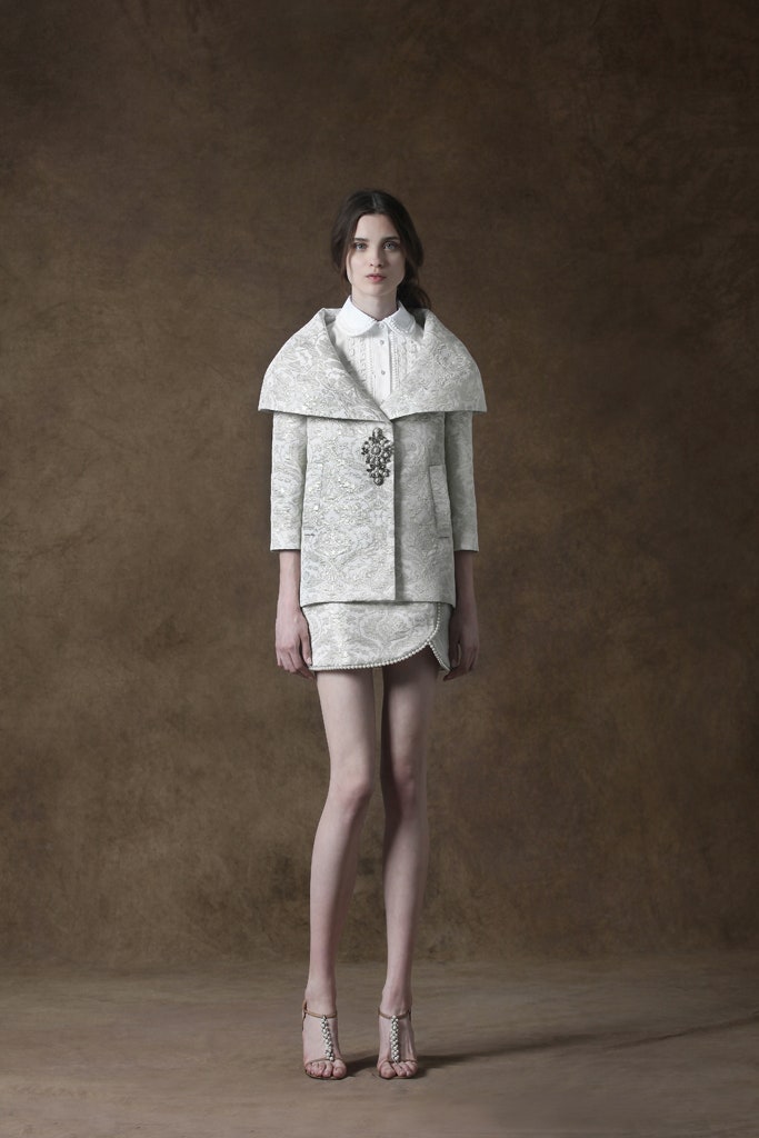 white fitted jacket and mini skirt