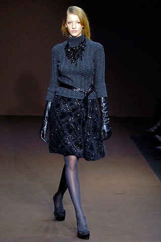 gray fitted sweater black pleated skirt