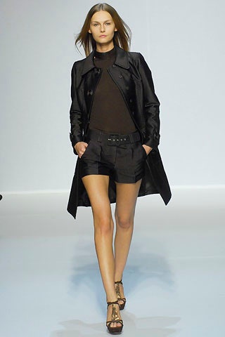 black fitted trench coat and shorts
