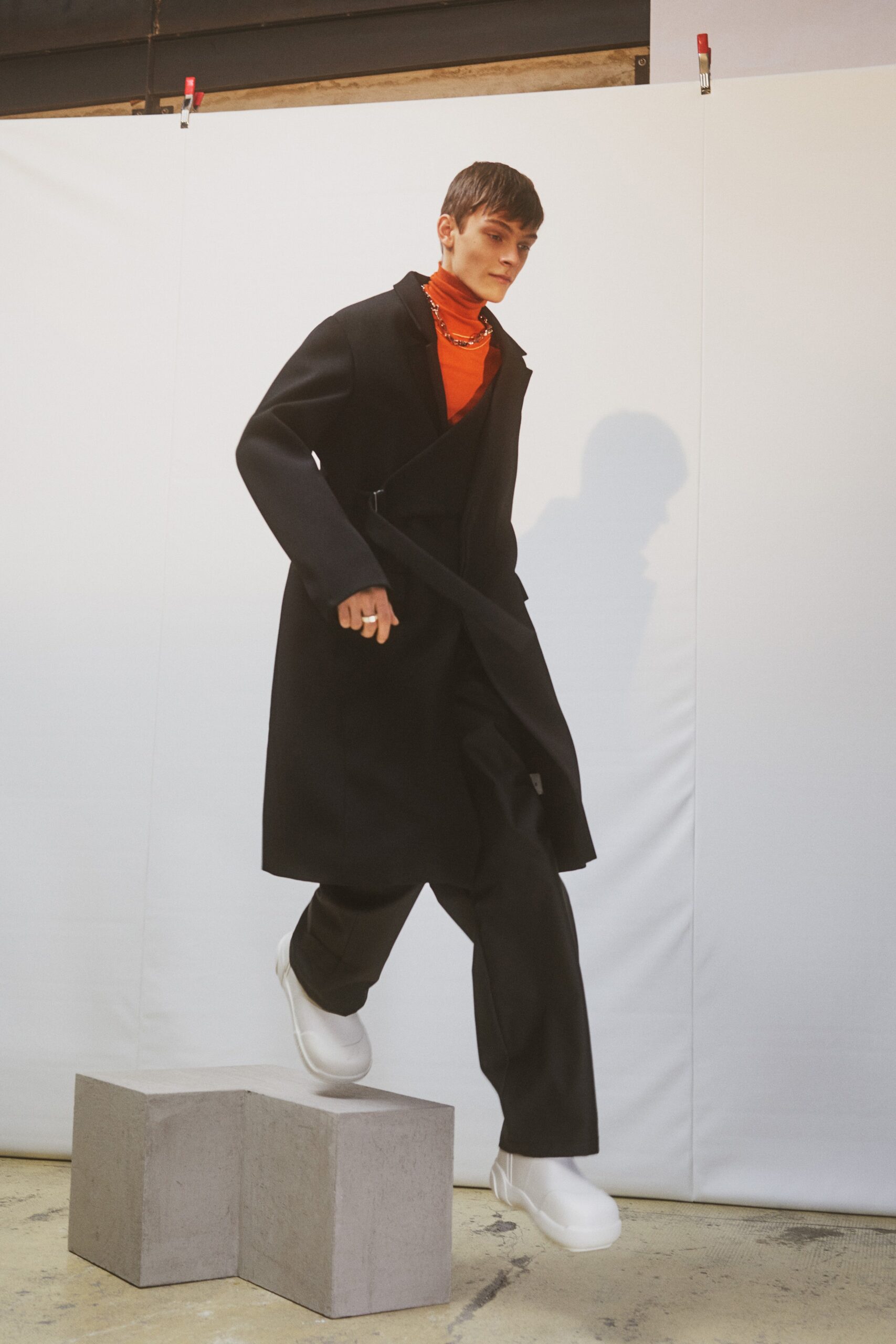black wool coat with orange top