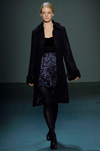 black wool coat and blue skirt