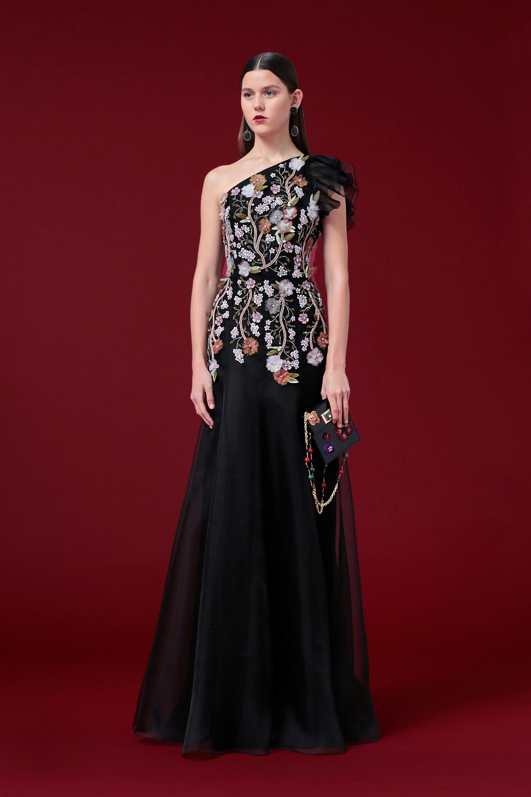 black embroidered gown with clutch