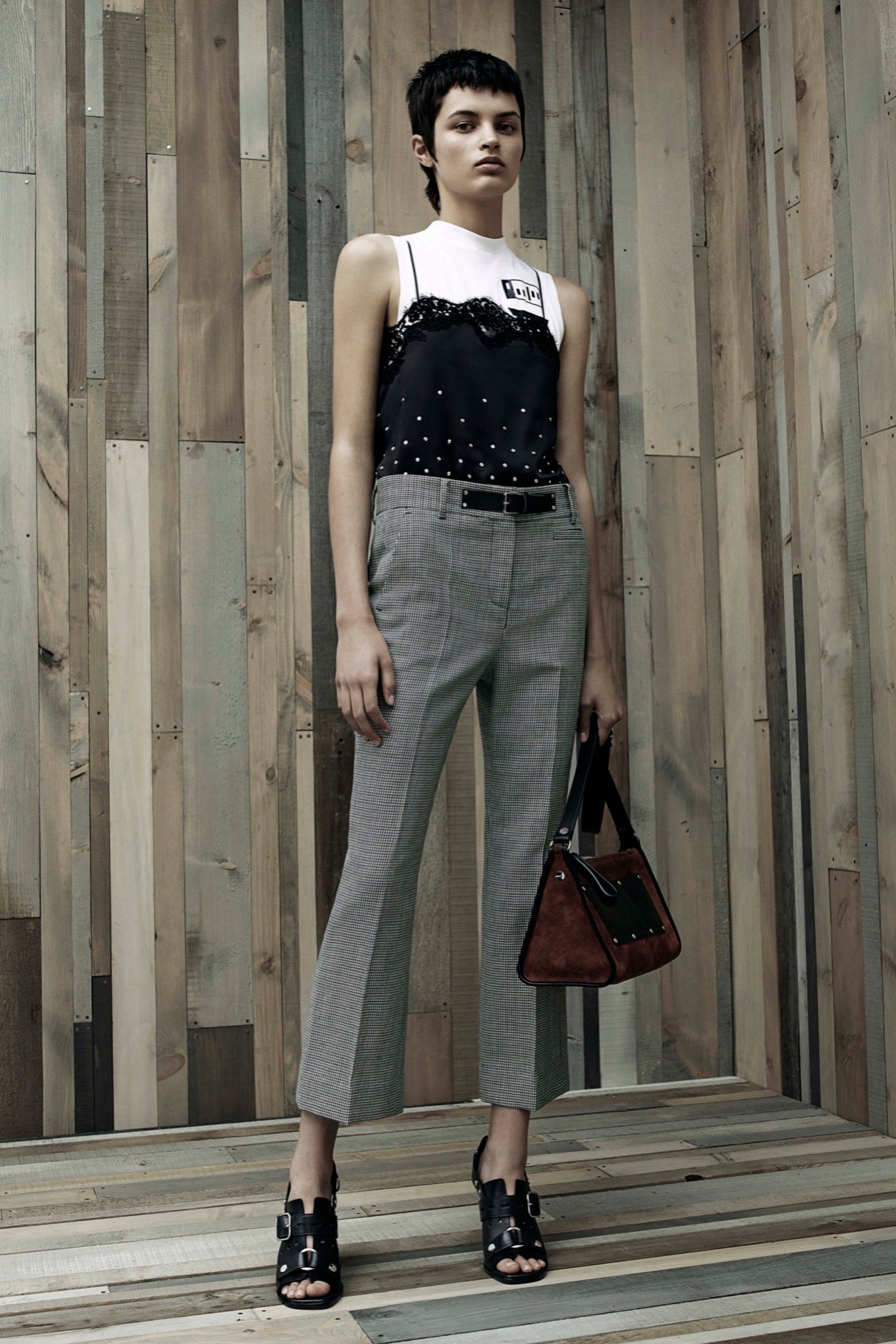 black and white fitted top with tailored pants