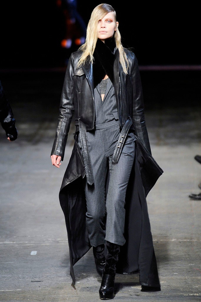 black leather coat and gray jumpsuit