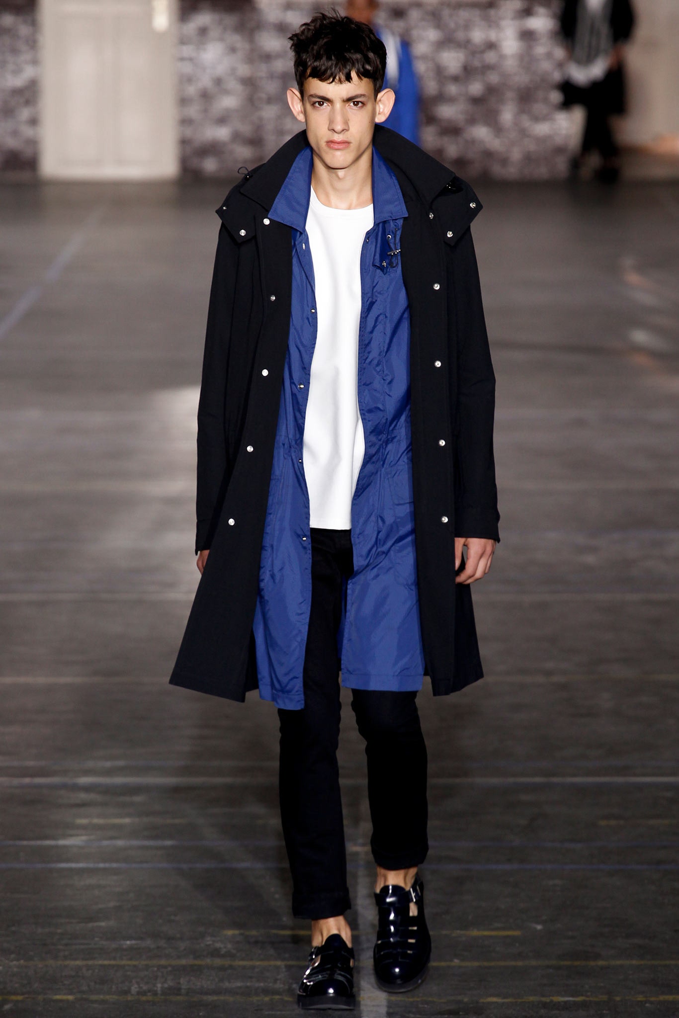 black coat blue jacket white shirt black pants