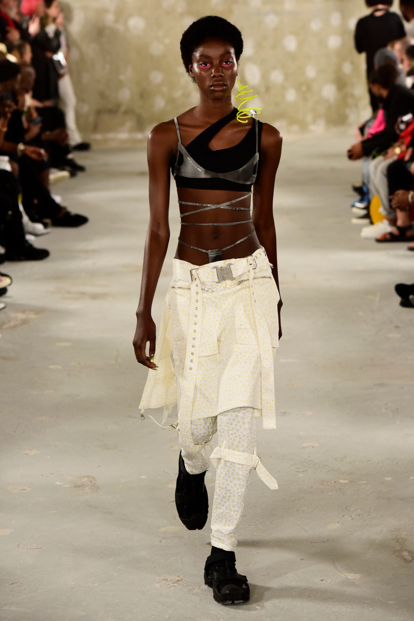 black fitted sleeveless top and white relaxed pants