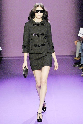 black fitted jacket and mini skirt