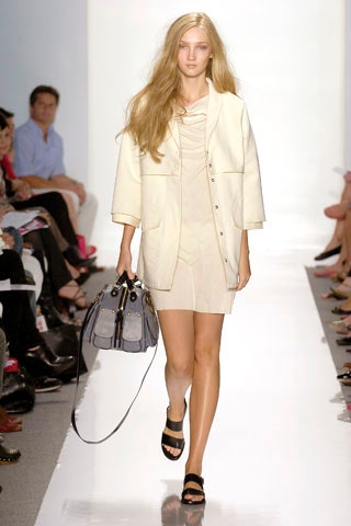 beige fitted sleeveless dress with white jacket