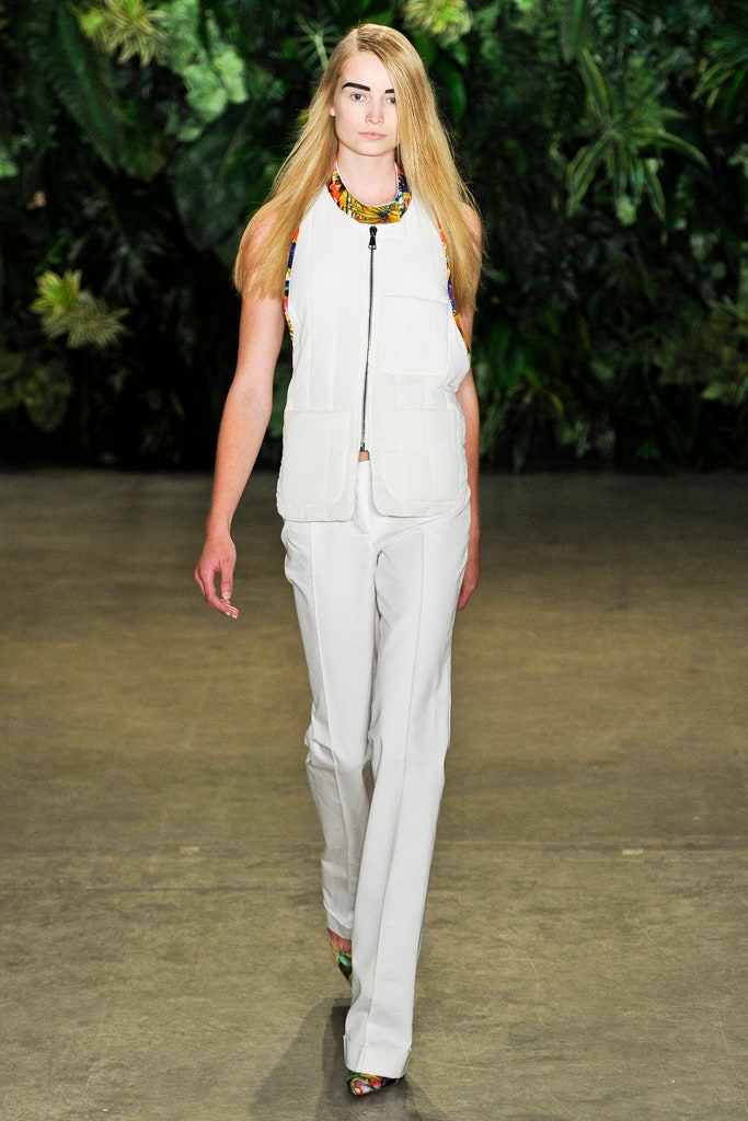 white fitted vest and tailored pants