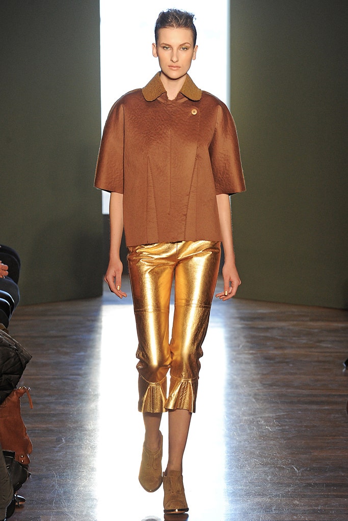 brown silk relaxed jacket and gold pants
