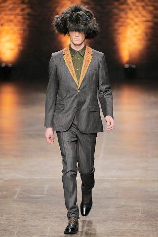 gray tailored suit with fur hat