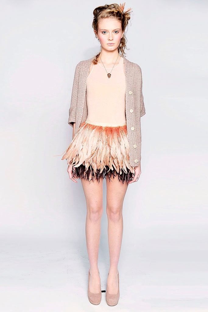 beige top with feathered mini skirt