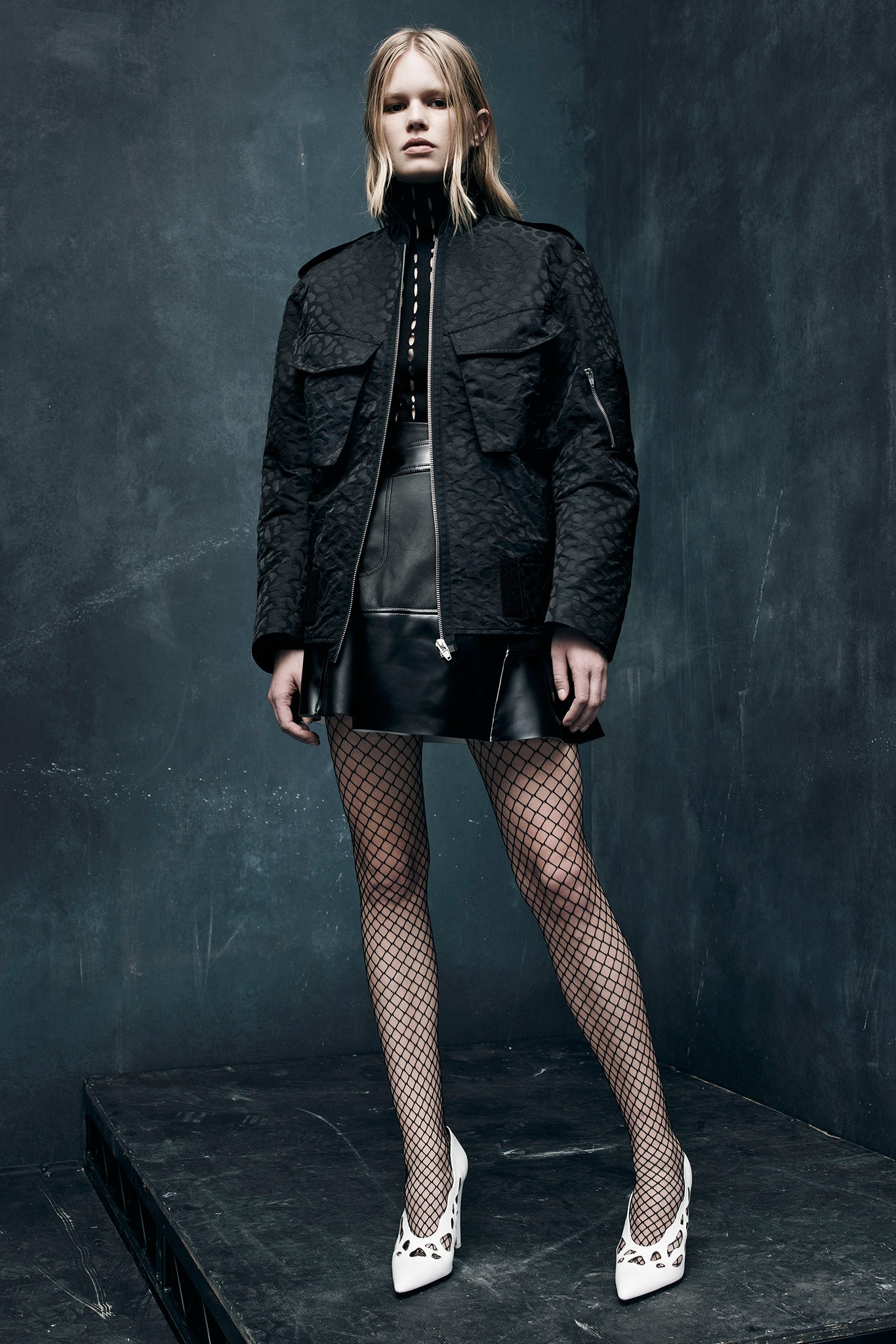 black fitted jacket and mini skirt