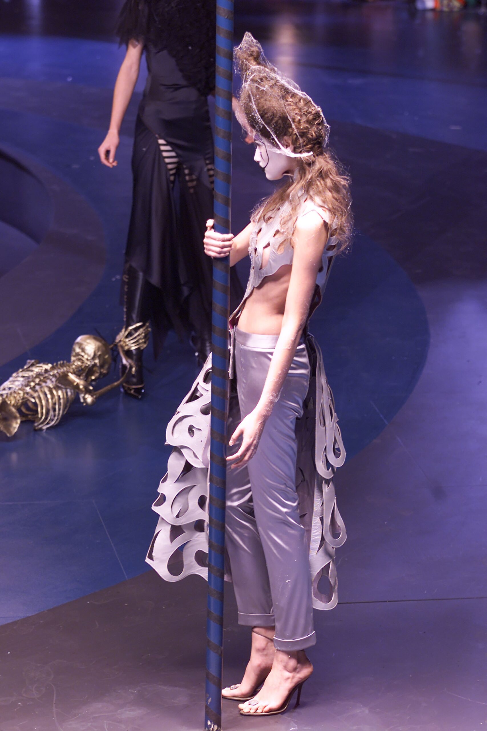 gray silk fitted pants and white sleeveless top