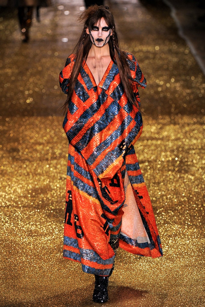 orange and blue sequin cape