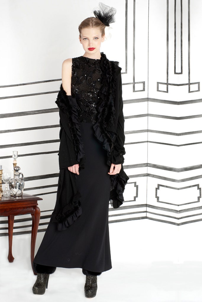 black silk gown with ruffled cape