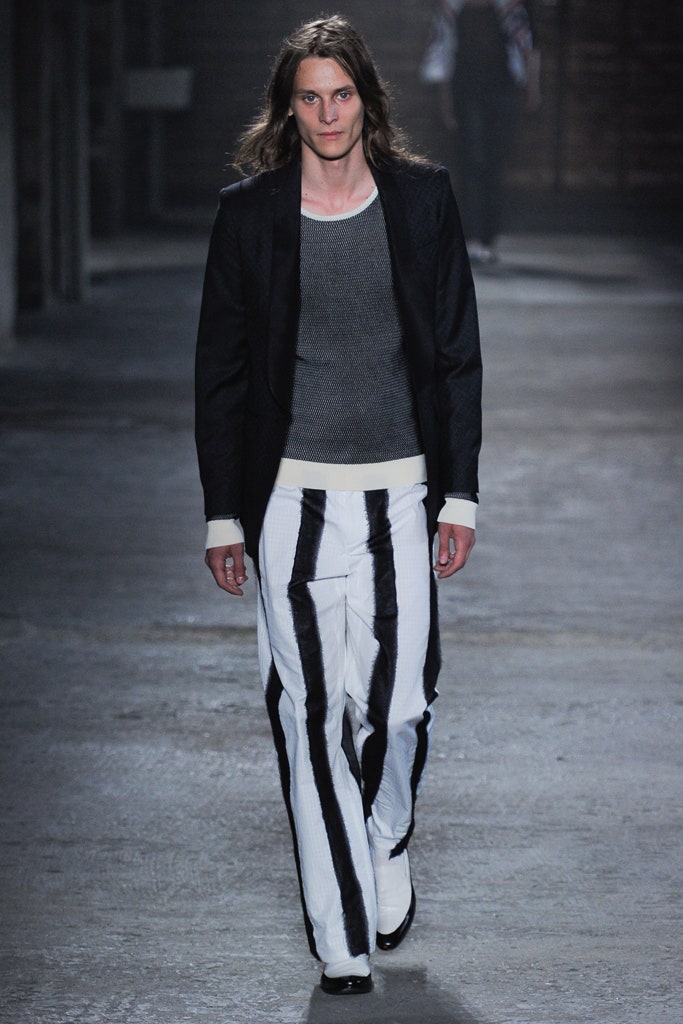 black tailored blazer gray fitted top white striped pants