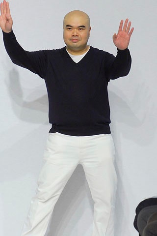 black v-neck sweater and white pants
