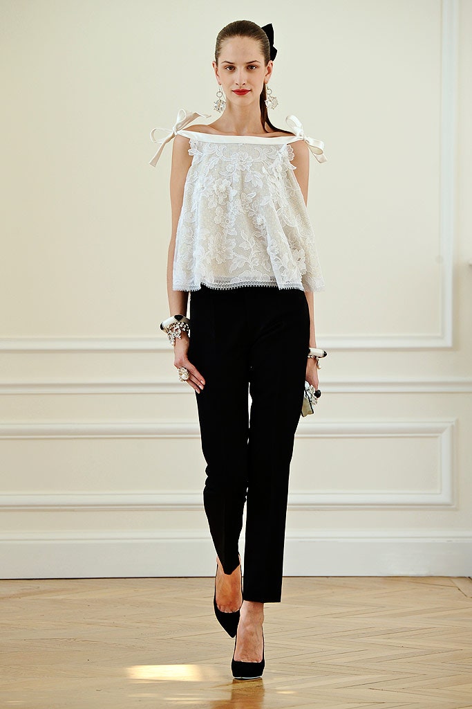 white lace off-shoulder top with black pants
