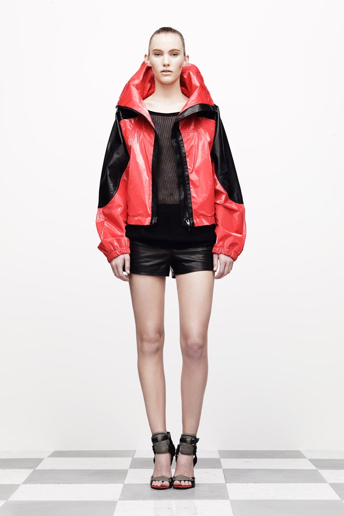 red vinyl hooded jacket with black top
