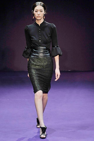 black fitted blouse and leather skirt