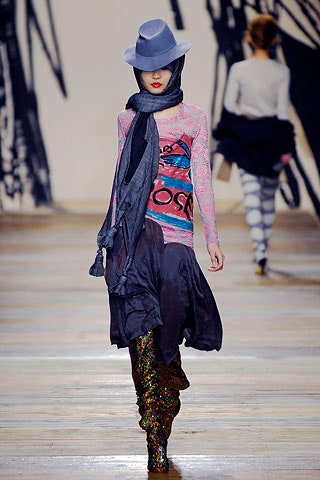 fitted pink top with asymmetric black skirt