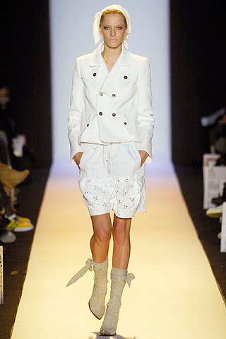 white fitted jacket and relaxed shorts