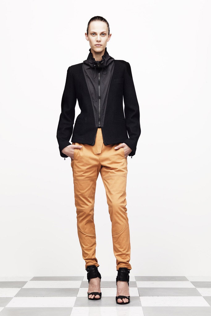 black structured jacket with orange pants
