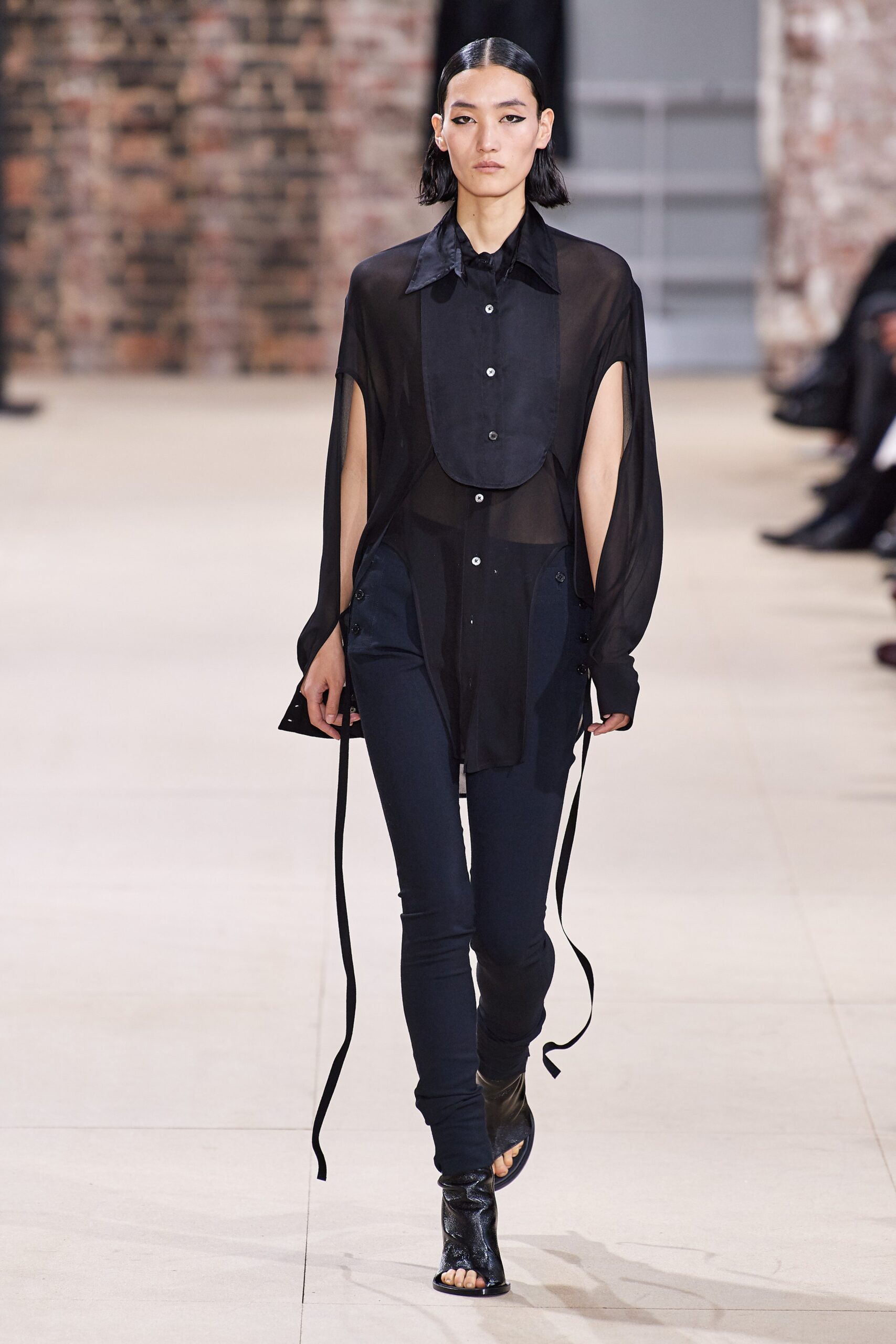 black sheer shirt and fitted pants