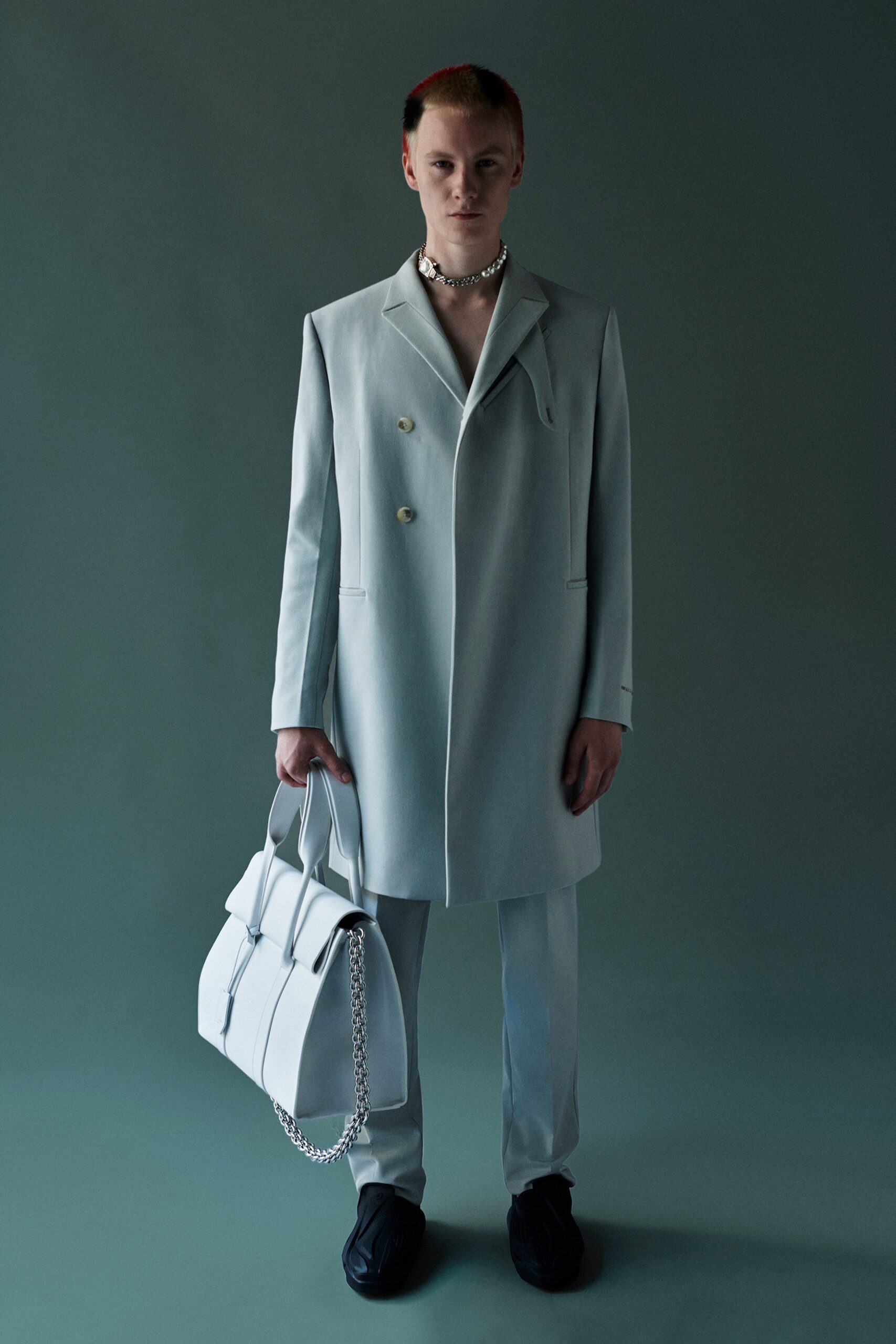 white tailored suit with bag