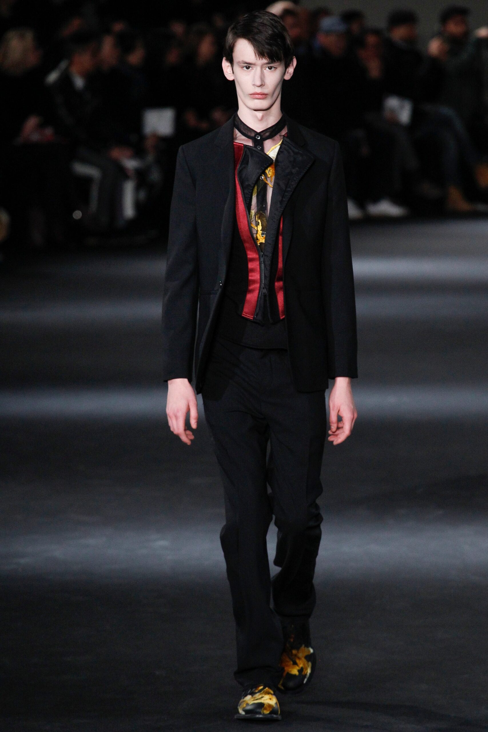 black tailored suit with red shirt