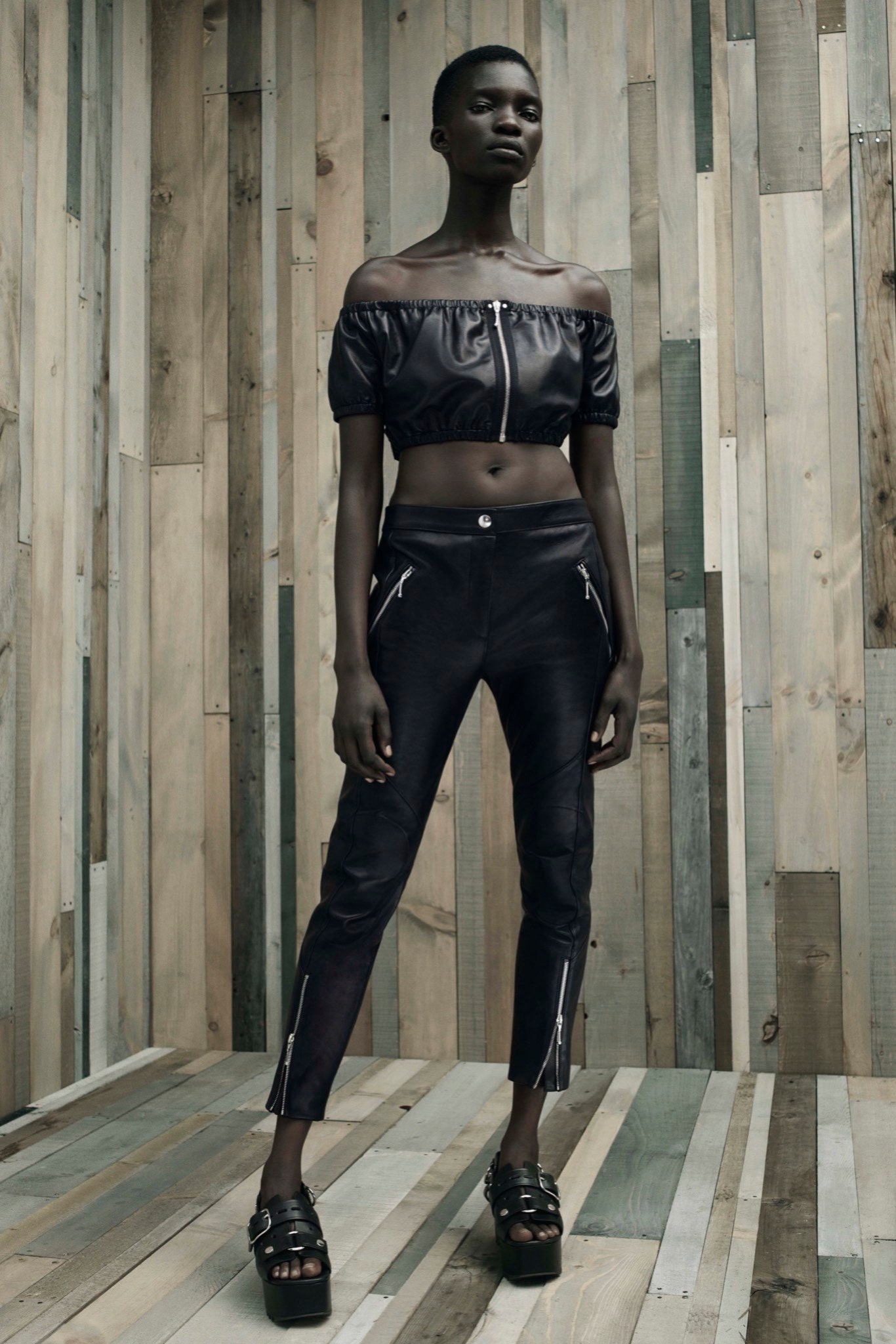 black leather crop-top and pants