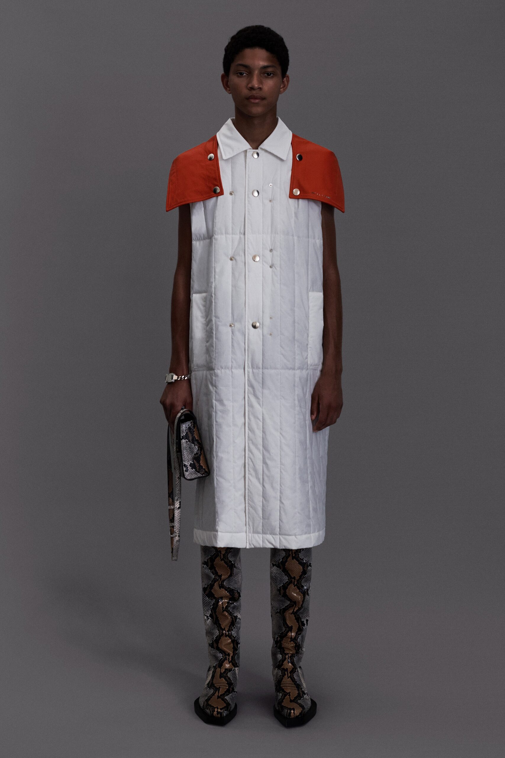 white quilted coat with orange details