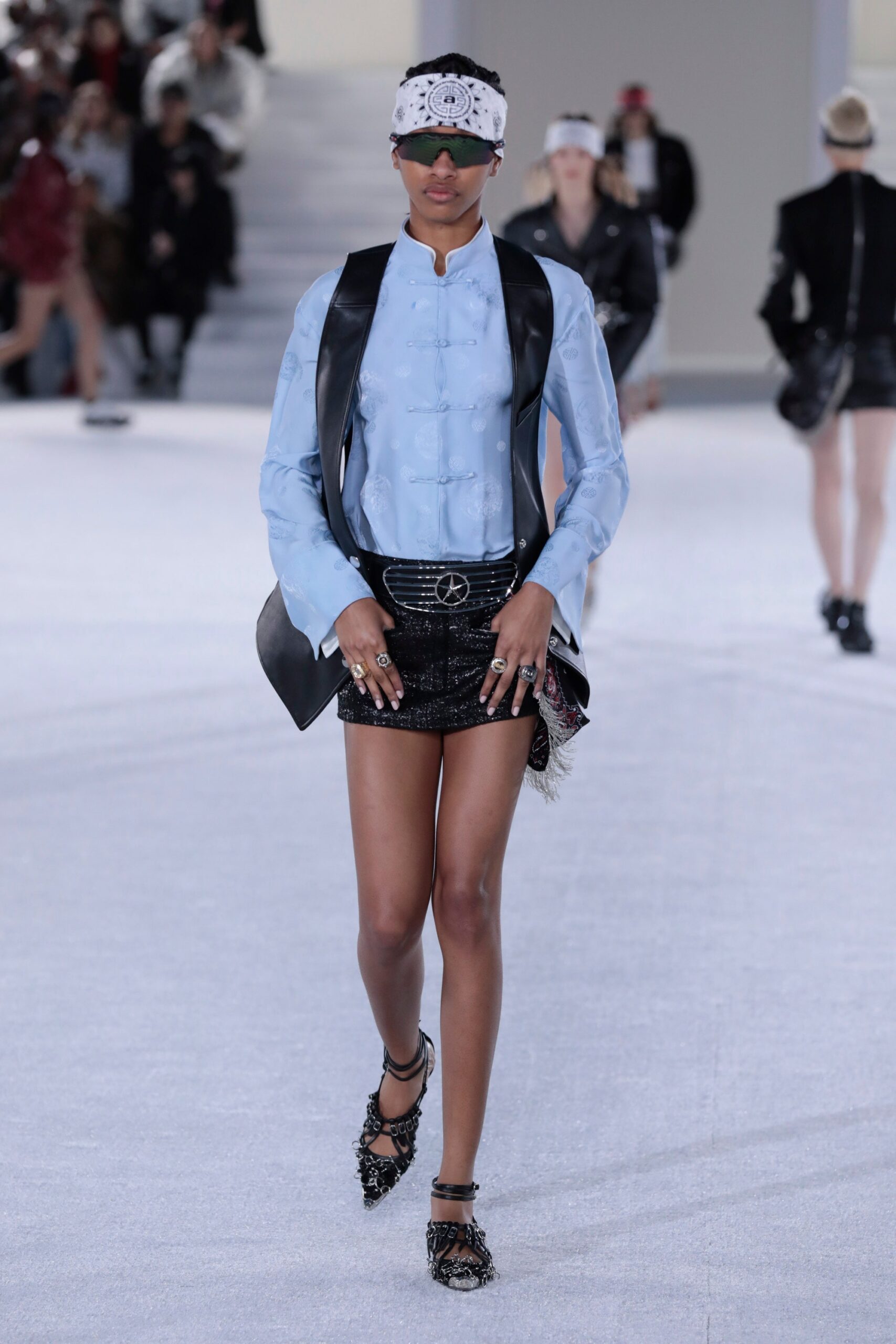 blue silk blouse and black skirt