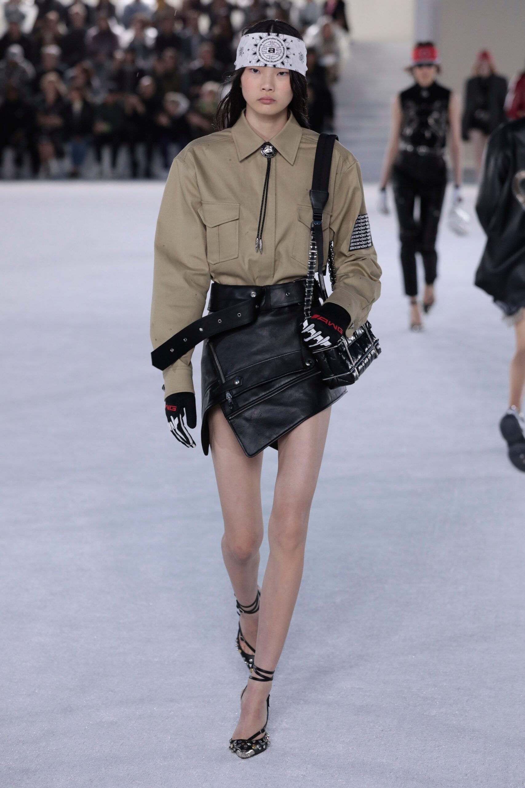 beige relaxed shirt with black leather skirt