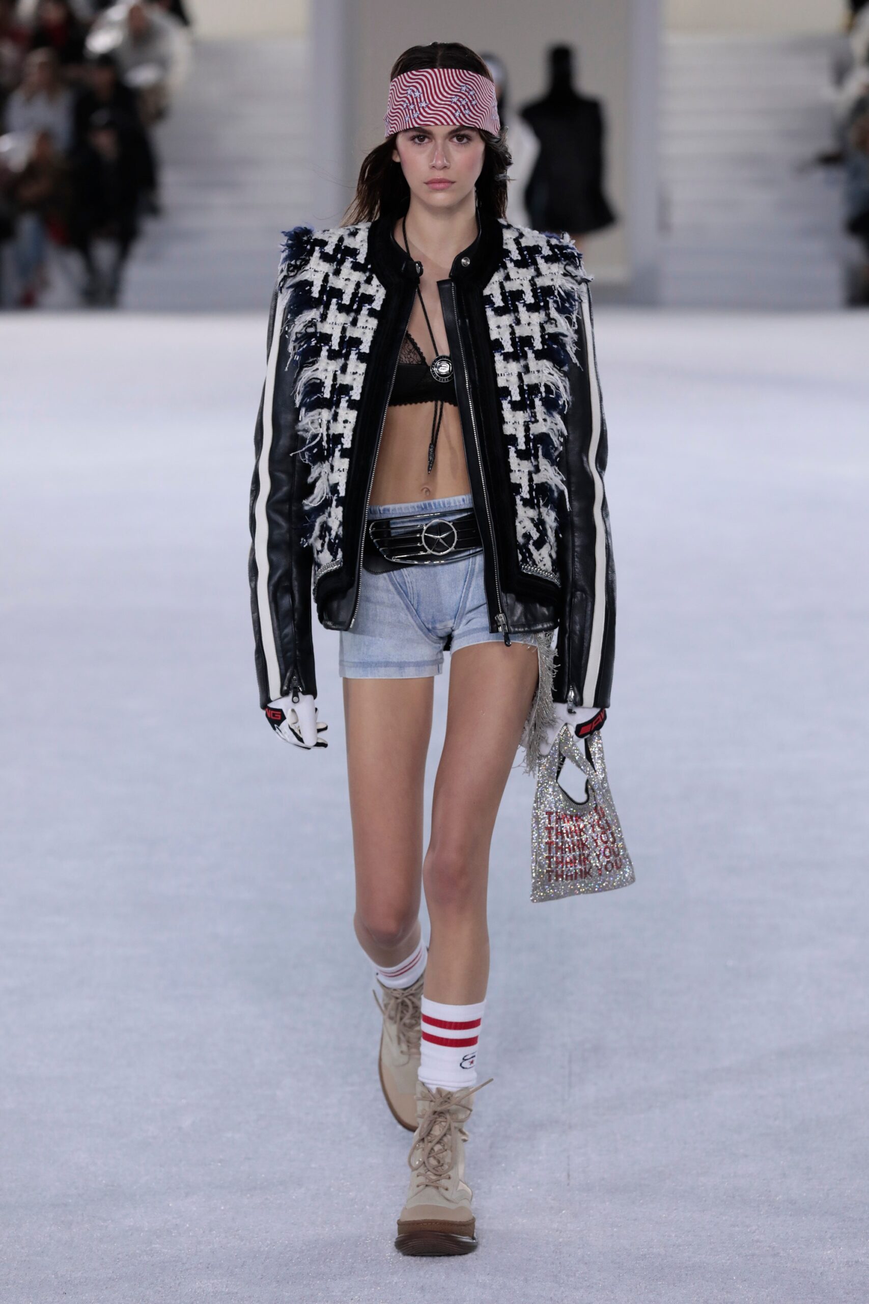 black and white leather jacket with denim shorts