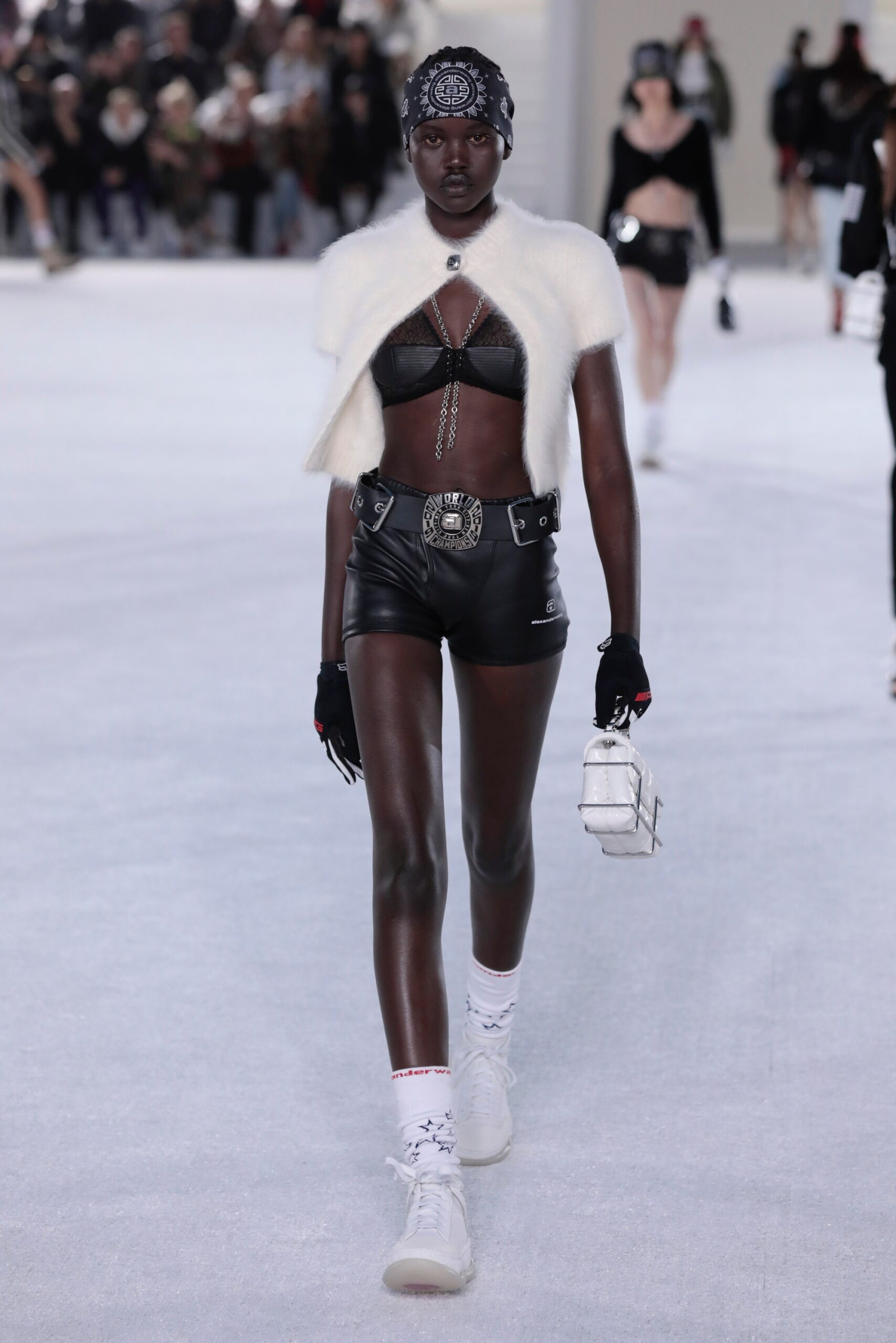black leather top and shorts with white cape