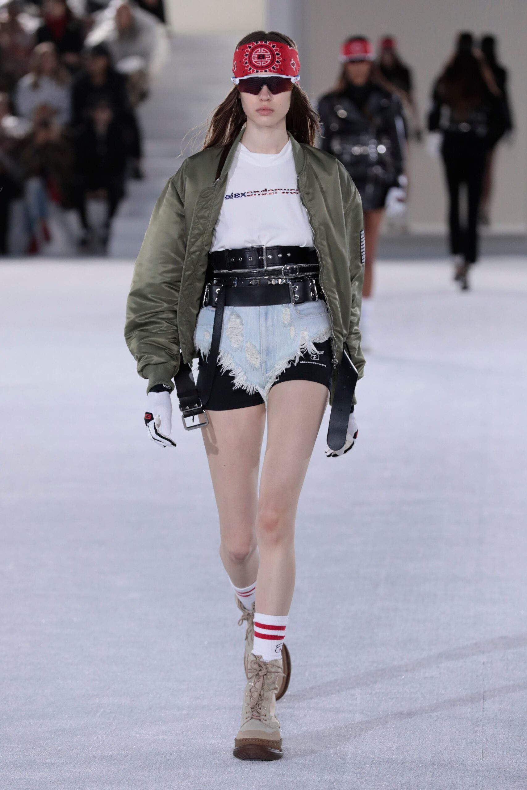 green jacket white t-shirt denim shorts