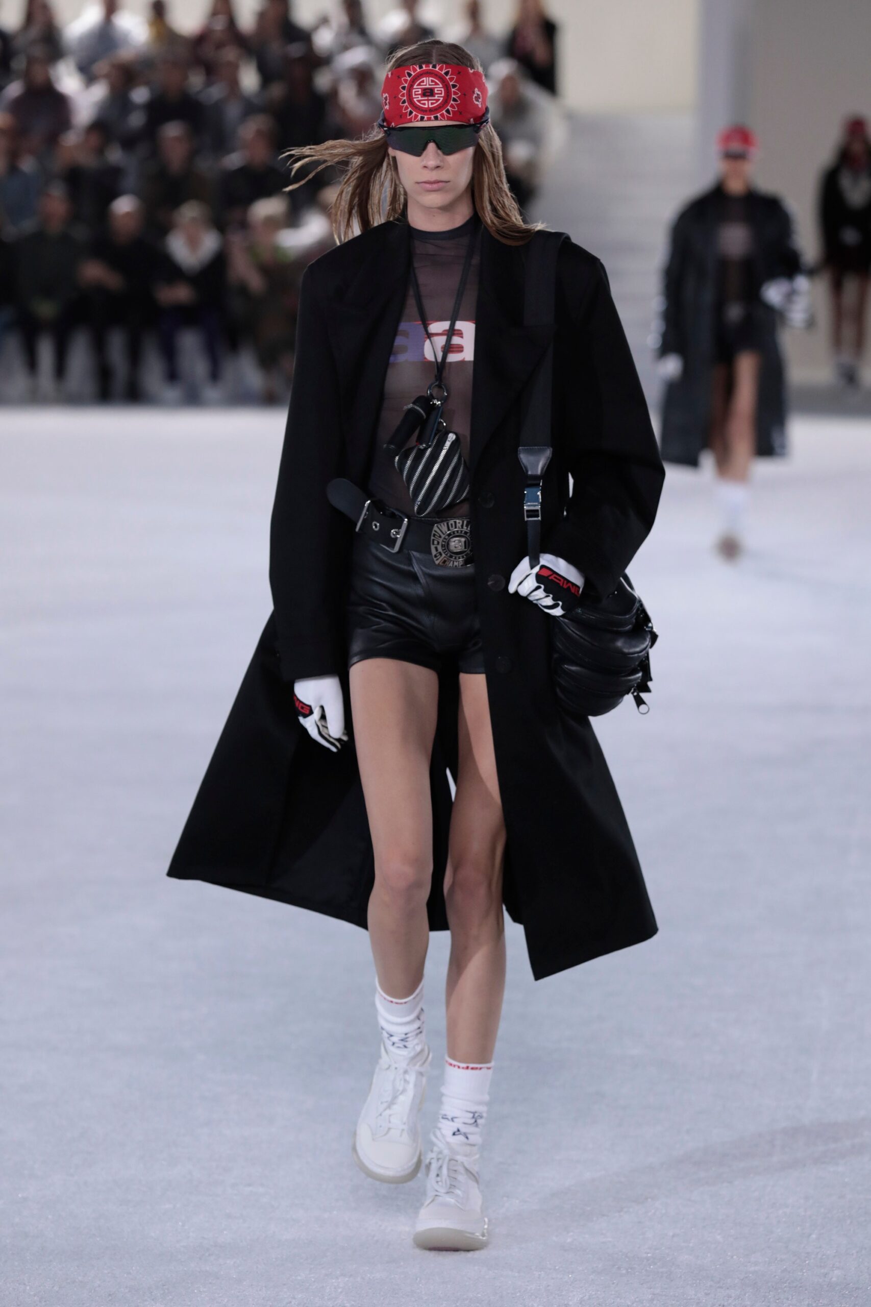 black wool coat with leather shorts