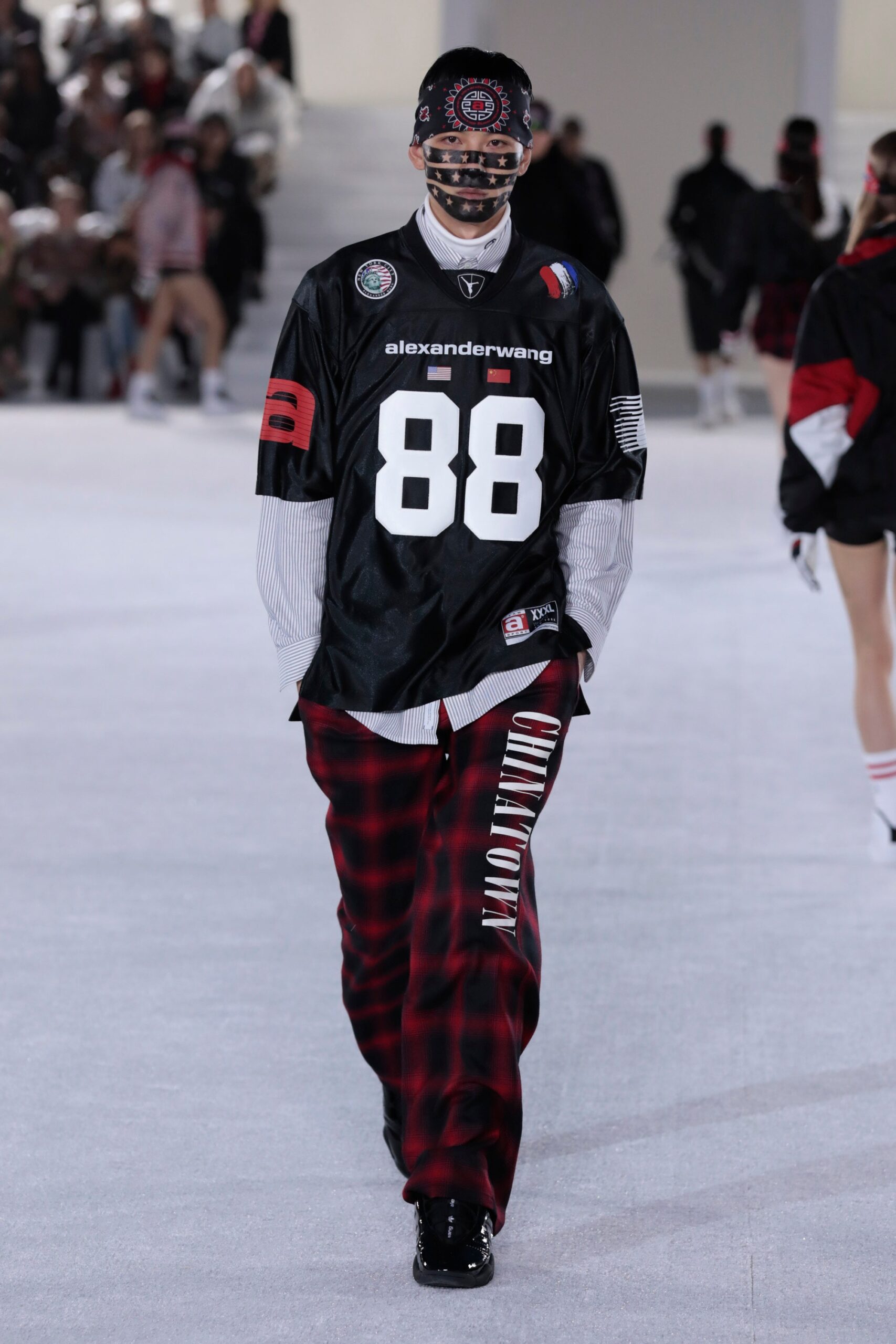 black fitted top with checked pants