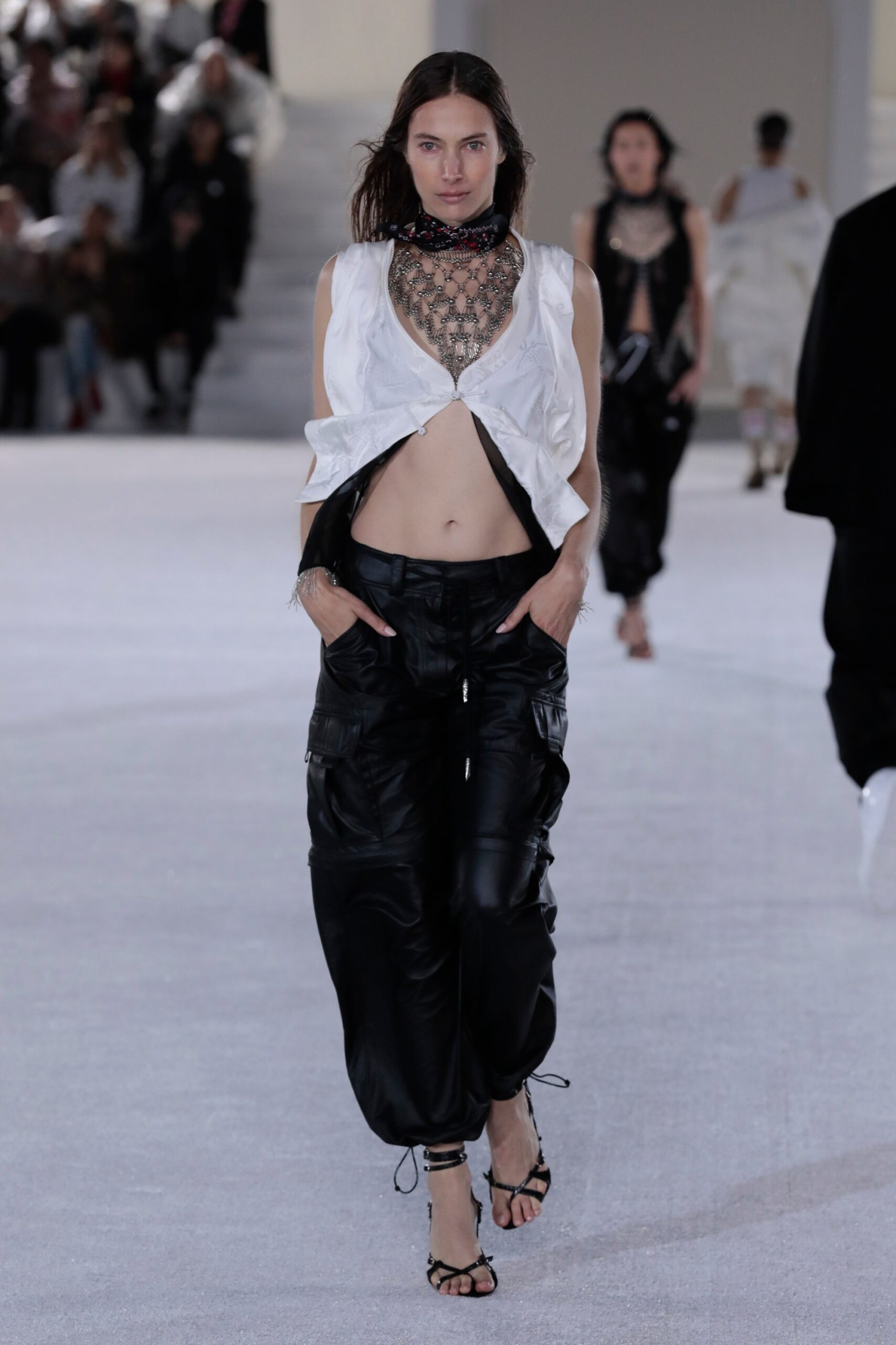 white cropped top and black cargo pants