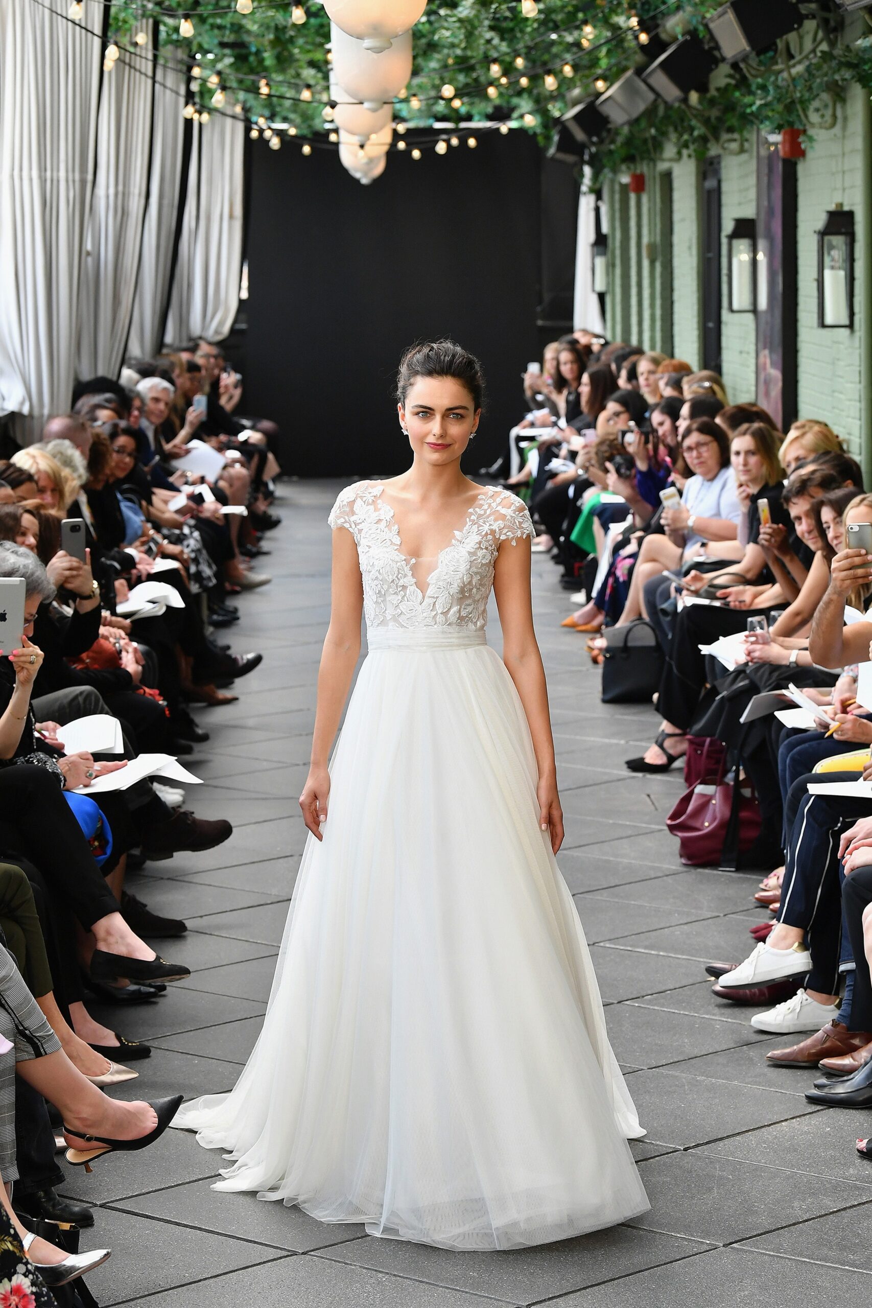 white embroidered sleeveless gown
