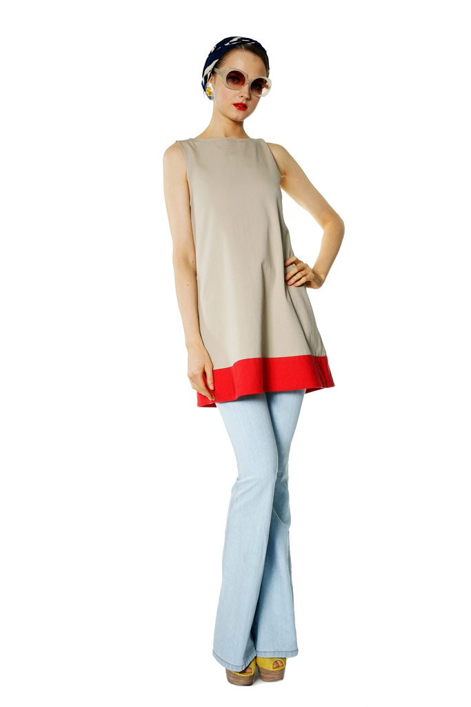 beige sleeveless top with flared pants