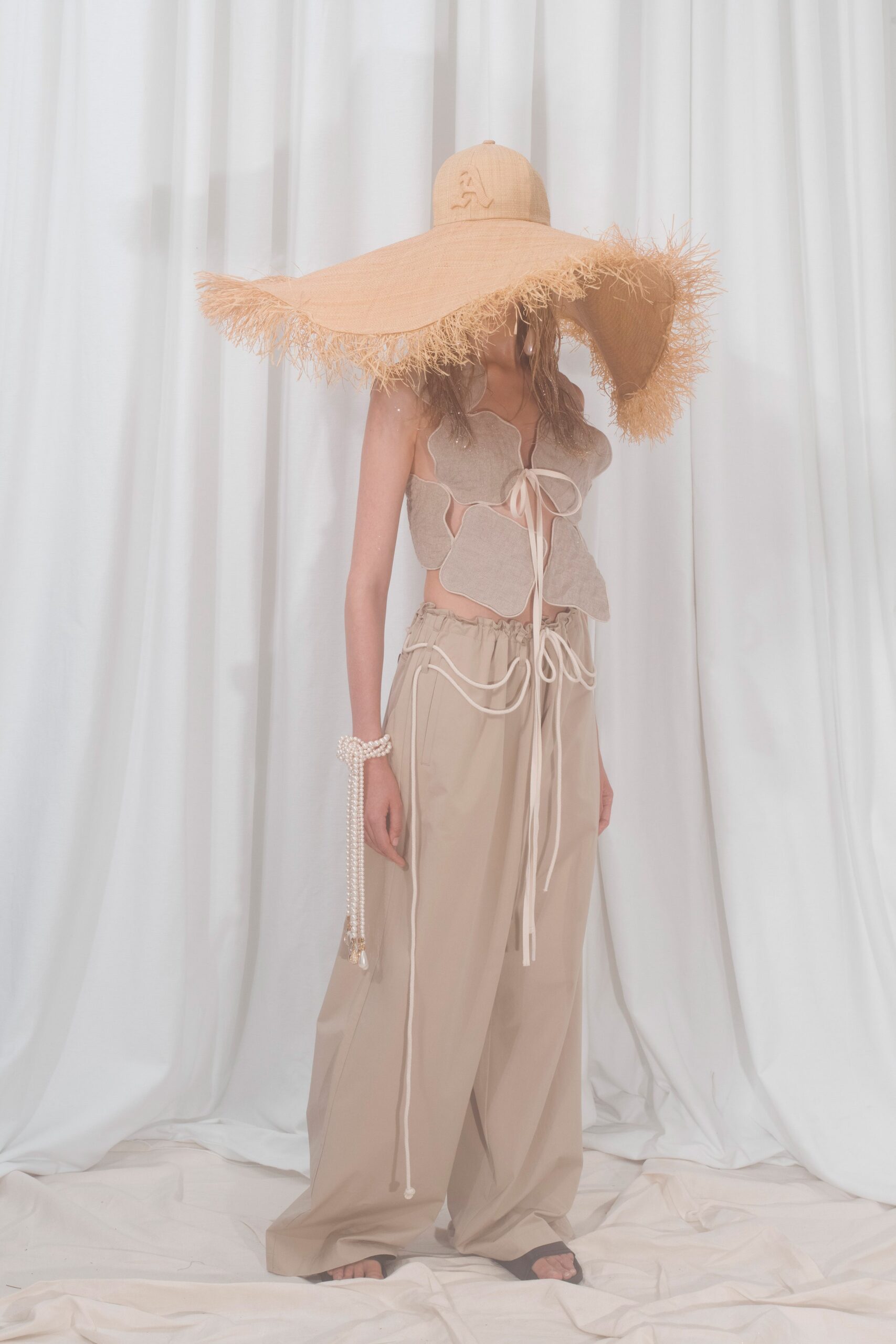 beige layered top and wide-leg pants